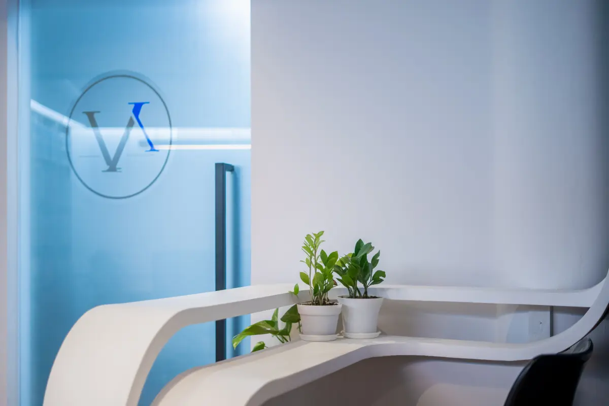 The Avon Chambers monogram beside a reception desk